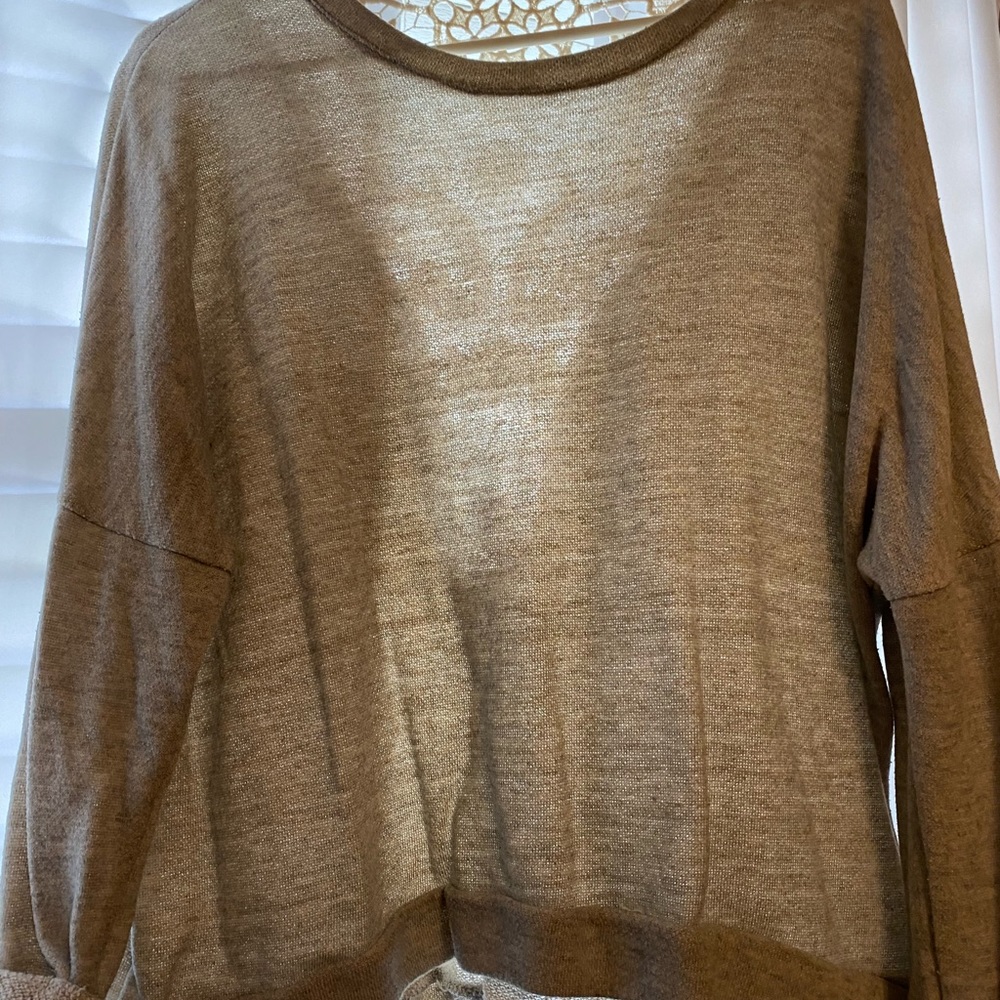 Grey tunic with lace detail back. Tag removed. Size L